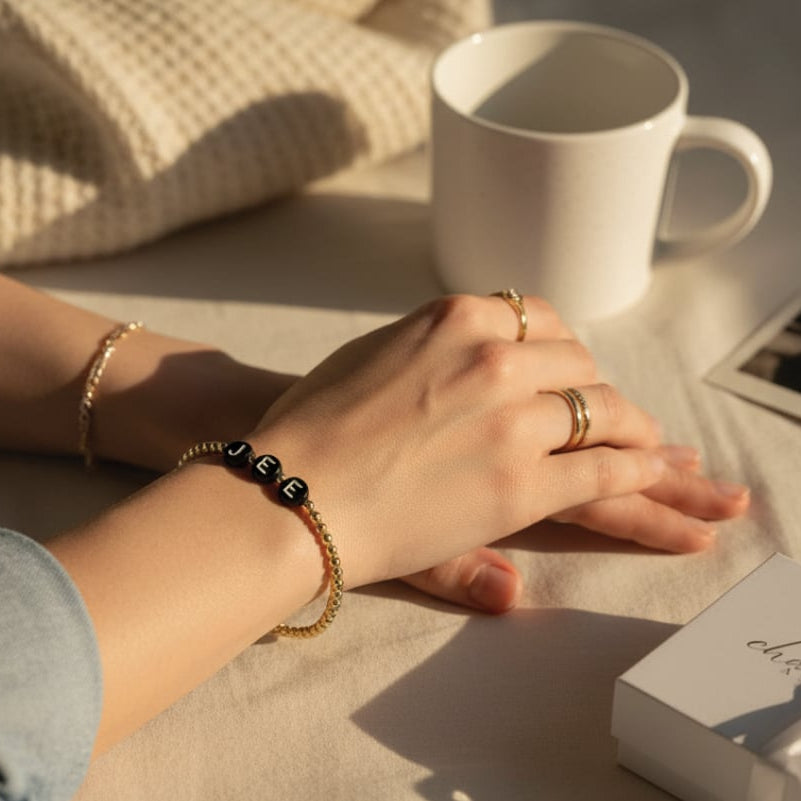 The Names We Carry | 14K Gold-Filled Bracelet With Black Letter Beads