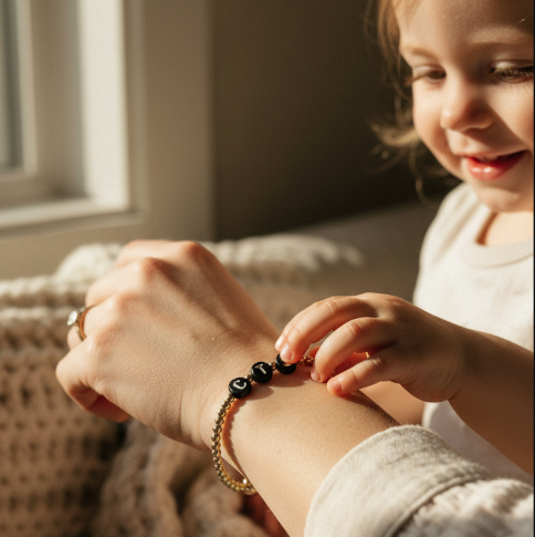 gold filled bracelet with black letter beads