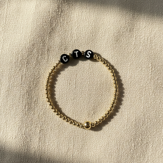 The Names We Carry | 14K Gold-Filled Bracelet With Black Letter Beads